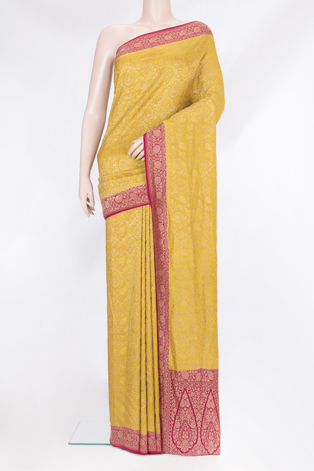 Mustard Banarasi Georgette Saree with Zari Brocade on the body and Zari Border.  displayed on a mannequin