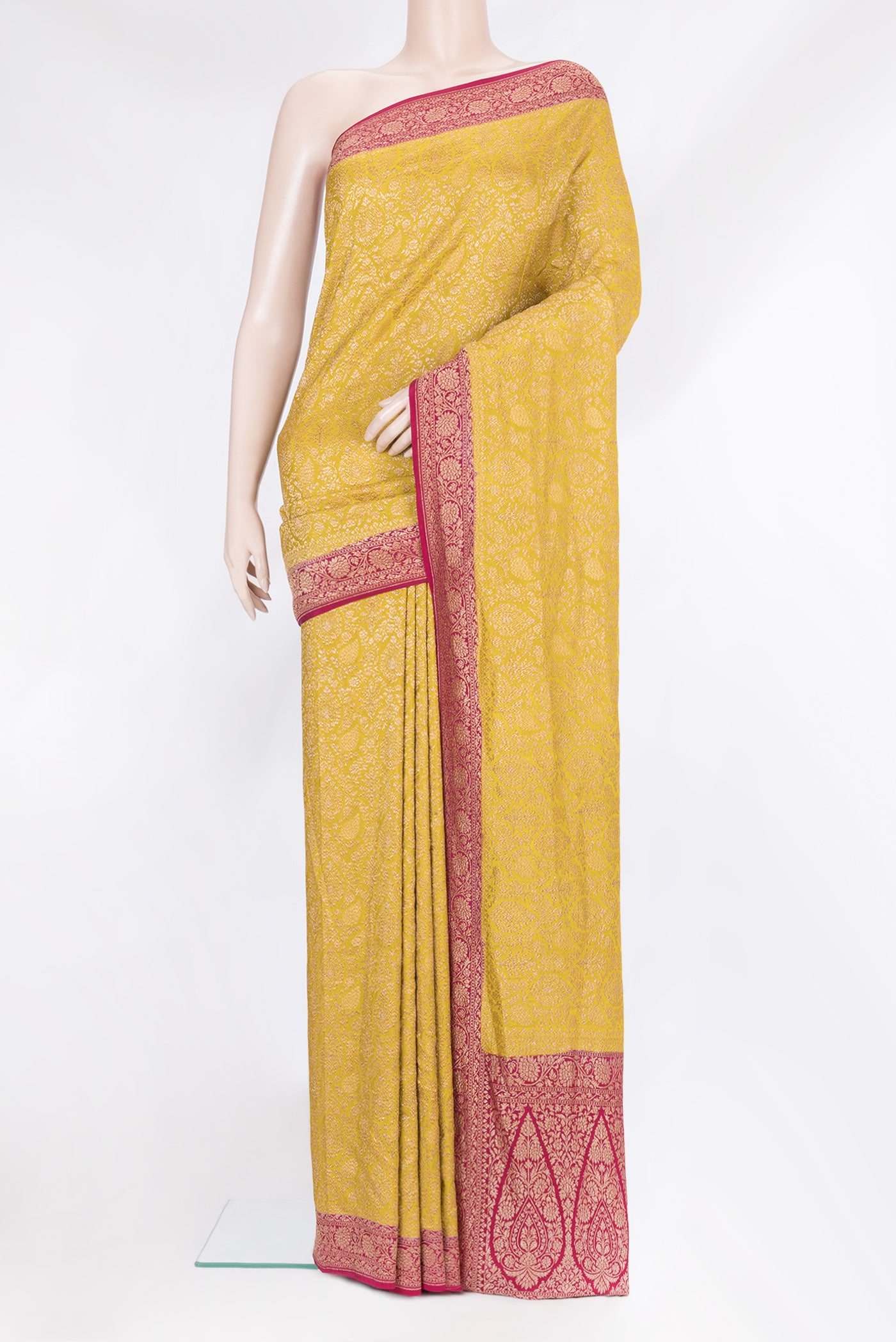 Mustard Banarasi Georgette Saree with Zari Brocade on the body and Zari Border.  displayed on a mannequin