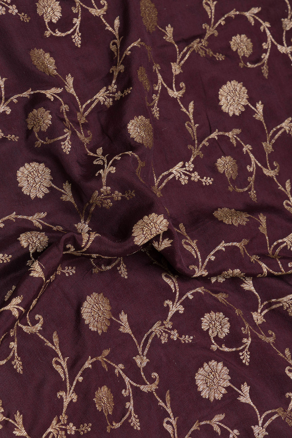 Close up of Coffee Brown Banarasi Georgette Saree with Zari Brocade on the body and Zari Border.  displaying folds