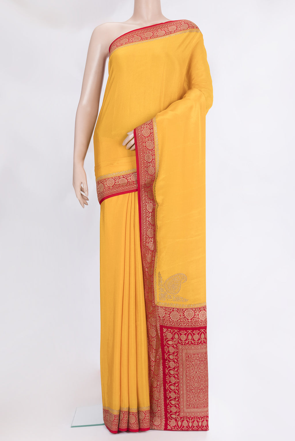 Yellow Banarasi Georgette Saree with Plain Body and Zari Border.  displayed on a mannequin