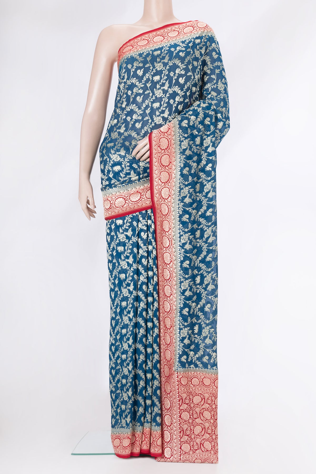 Peacock Blue Dual Tone Banarasi Georgette Saree with Zari Brocade on the body and Zari Border.  displayed on a mannequin