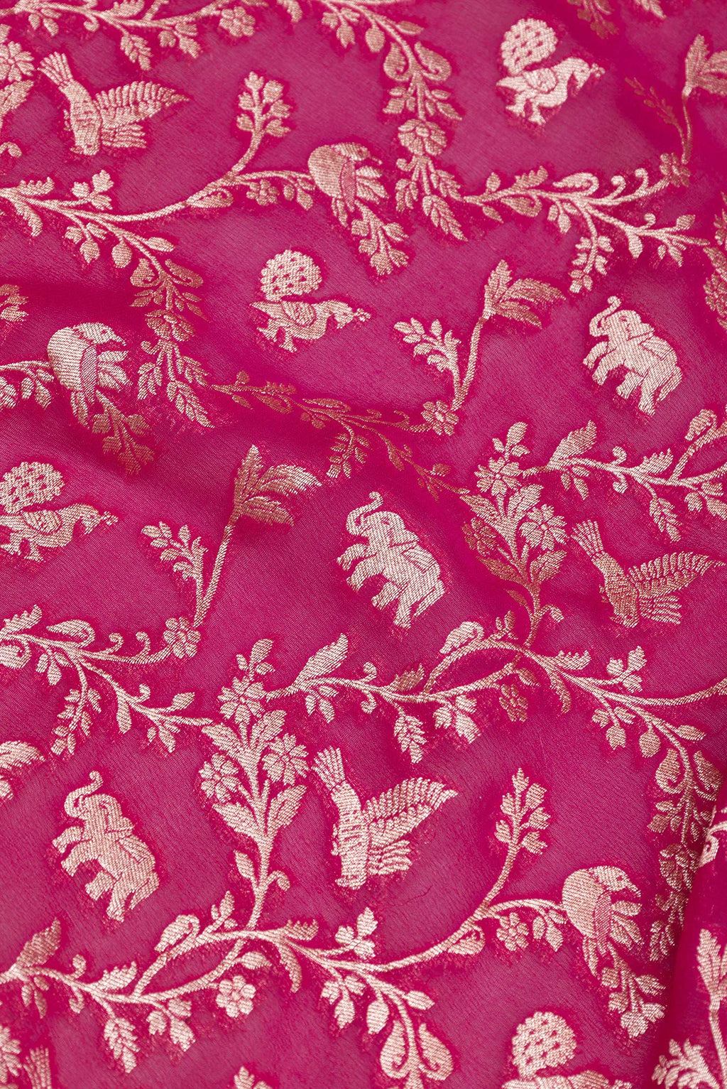 Close up of Pink Banarasi Georgette Saree with Zari Brocade on the body and Zari Border.  displaying folds