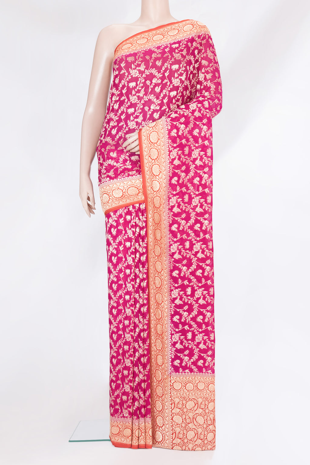 Pink Banarasi Georgette Saree with Zari Brocade on the body and Zari Border.  displayed on a mannequin