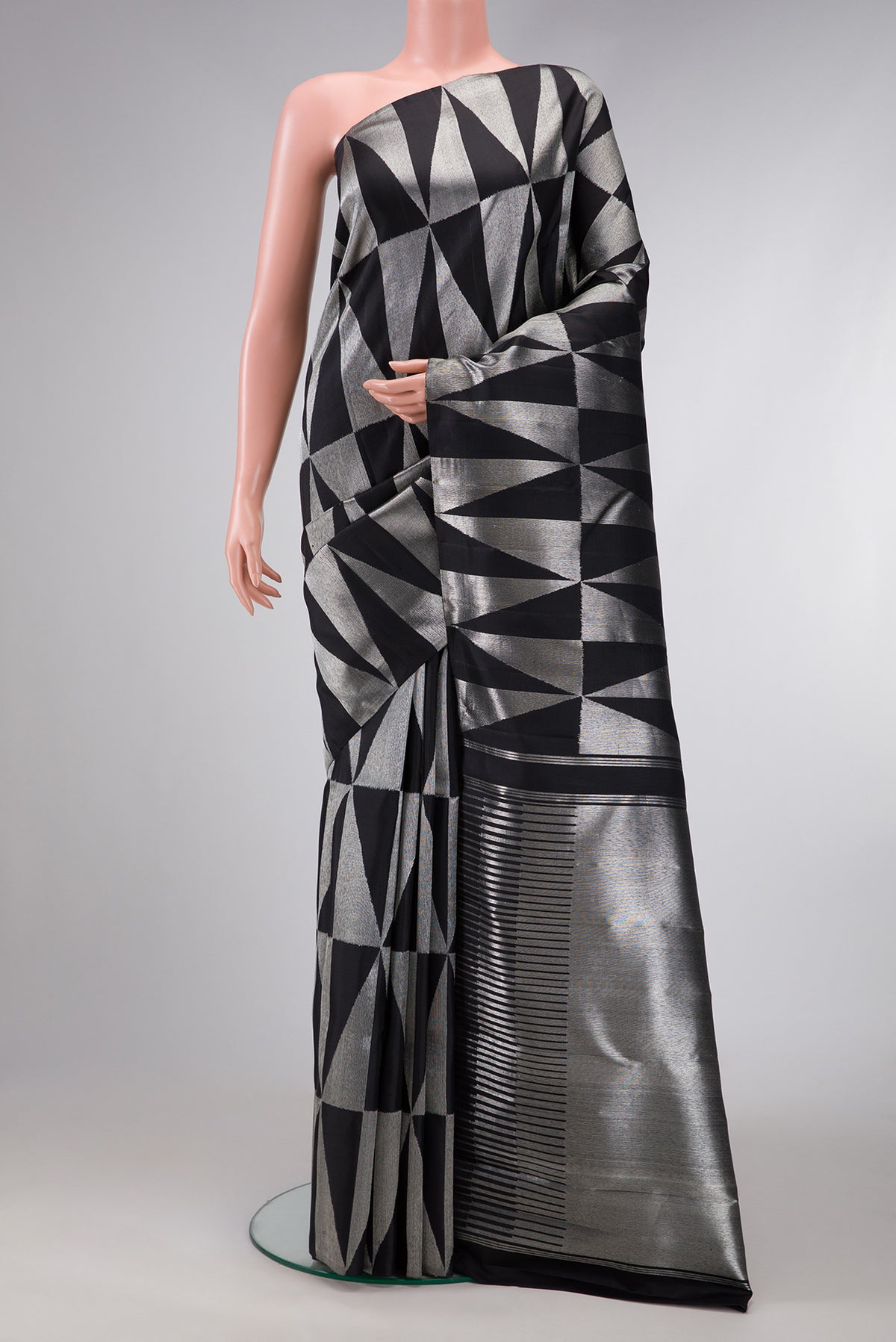 Black Dual Tone Kanchipuram Tissue Silk Saree with Zari Brocade on the body and Without Border.  displayed on a mannequin