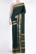 Bottle Green Mysore Chiffon Saree with Plain Body and Zari Border.  displayed on a mannequin