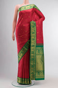 Red Kanchipuram Silk Saree with Zari Butta on the body and Zari Border displayed on a mannequin
