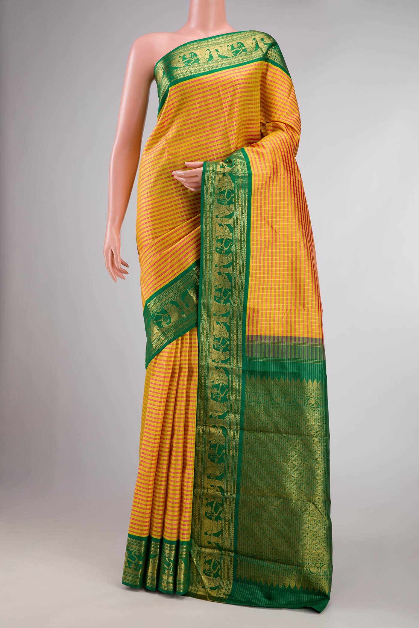 Yellow Dual Tone Kanchipuram Silk Saree with Checked design on the body and Fancy Border displayed on a mannequin