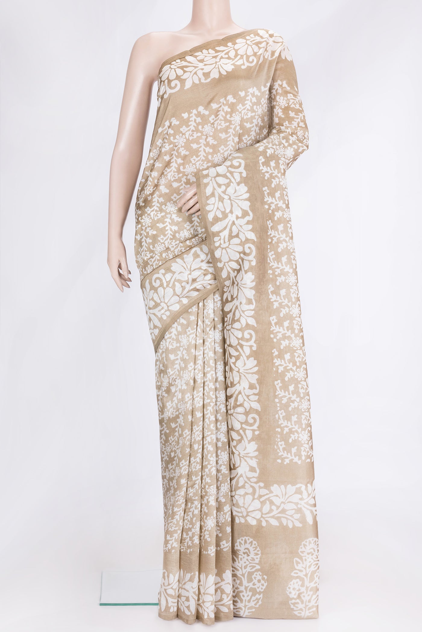 Beige Dual Tone Tussar Silk Saree with Printed design on the body and Printed Border.  displayed on a mannequin