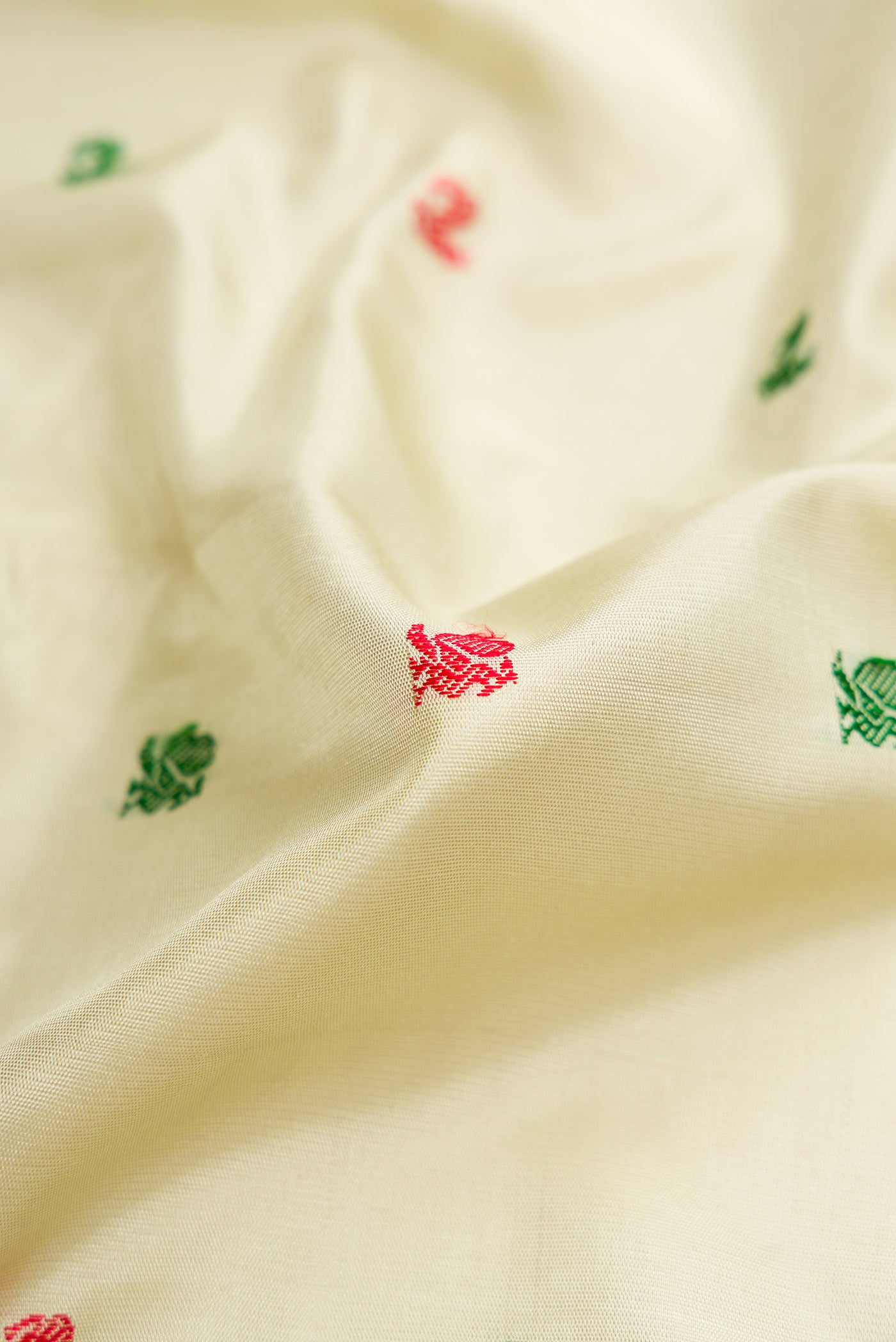 Close up of Light Green Dual Tone Gadwal Silk Saree with Zari Butta on the body and Zari Border displaying folds