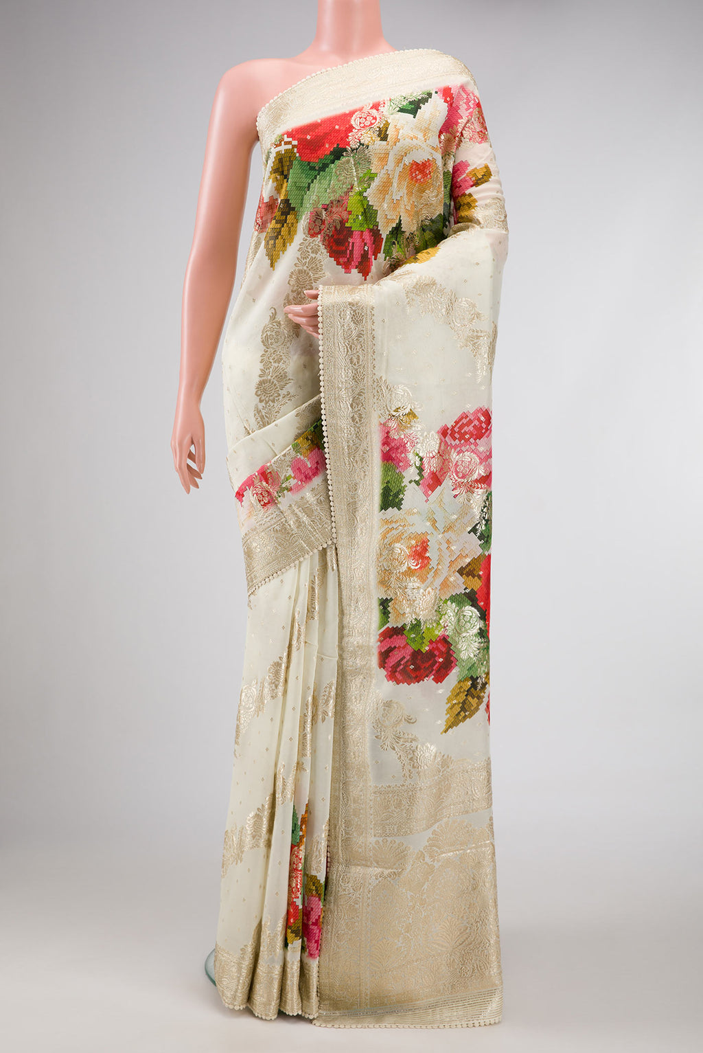 Off White Dual Tone Mysore Georgette Saree with Zari Butta on the body and Embroidery Border.  displayed on a mannequin