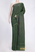 Bottle Green Dual Tone Kanchipuram Saree with Checked design on the body and Zari Border.  displayed on a mannequin