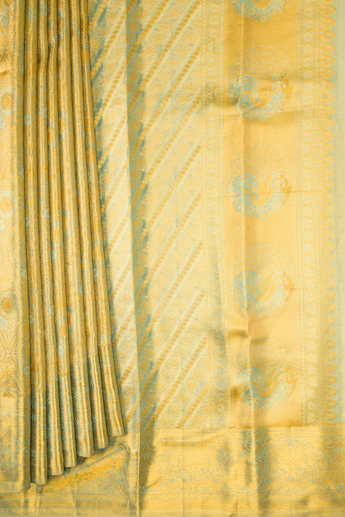 Pleats and pallu of Gold Dual Tone Kanchipuram Tissue Silk Saree with Zari Brocade on the body and Zari Border. 