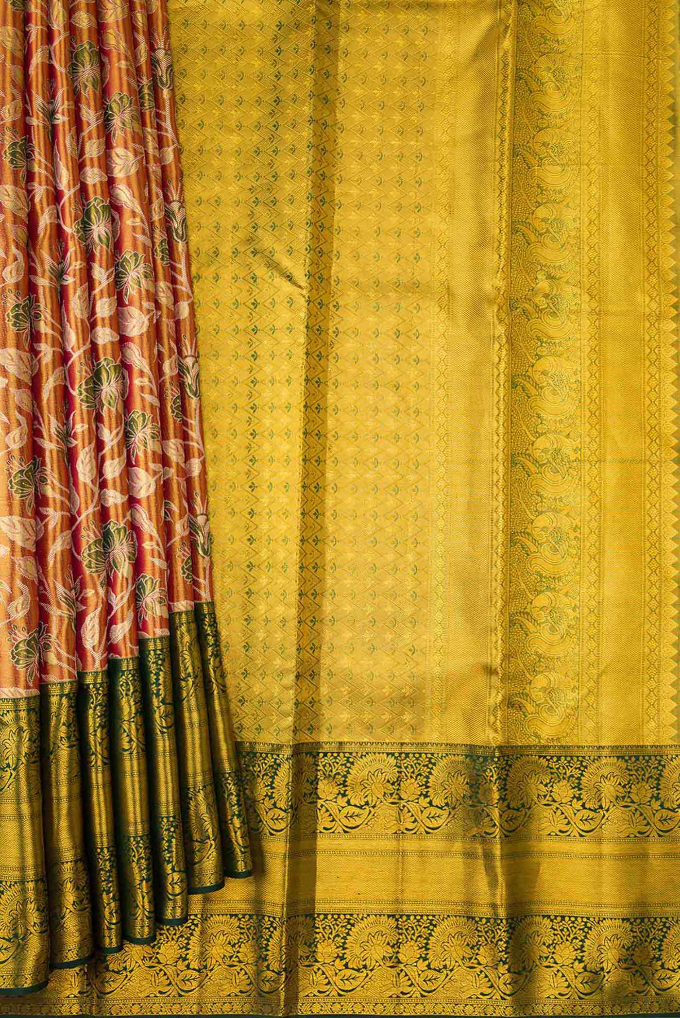 Pleats and pallu of Gold Dual Tone Kanchipuram Tissue Silk Saree with Zari Brocade on the body and Zari Border. 