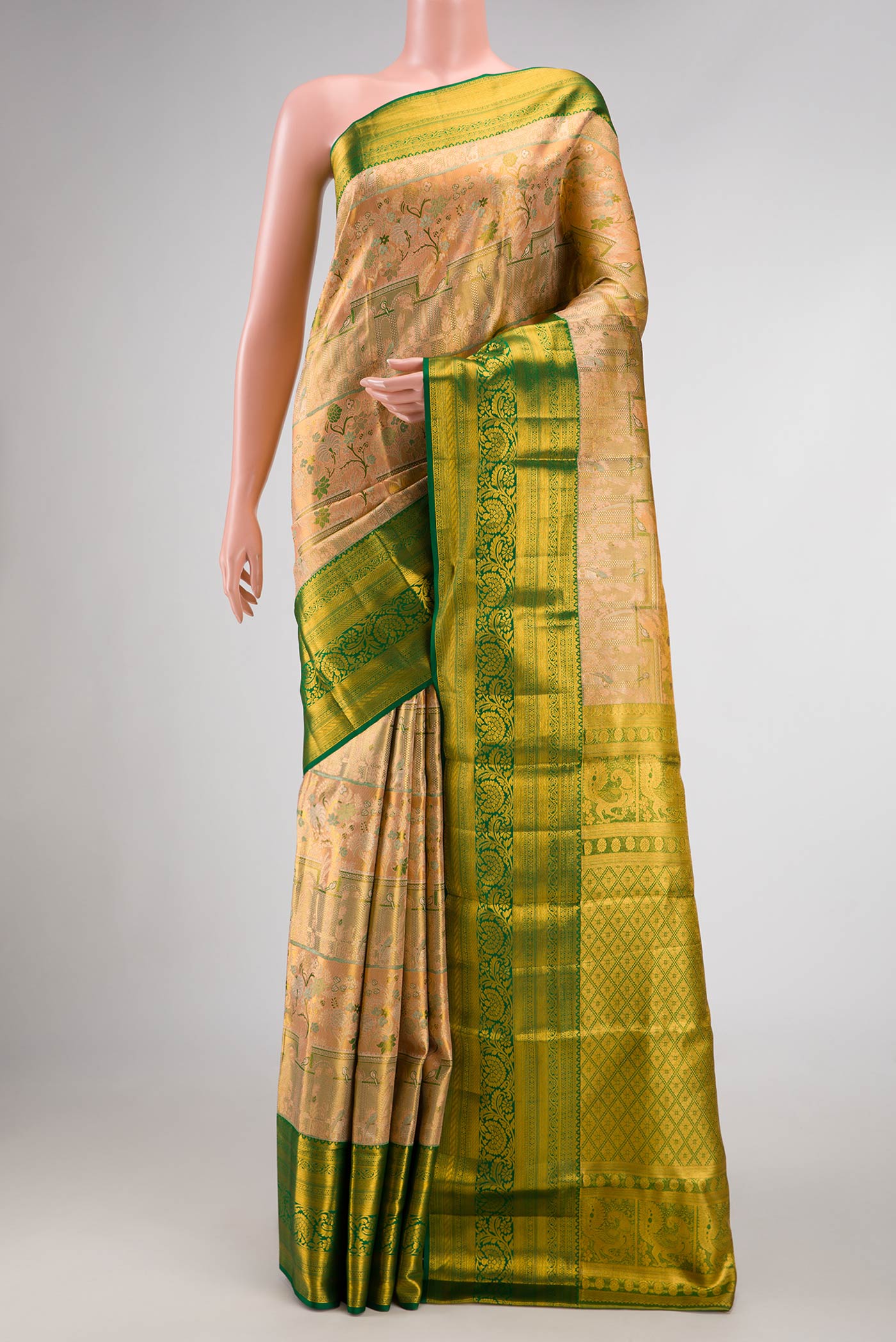 Peach Dual Tone Kanchipuram Tissue Silk Saree with Zari Brocade on the body and Zari Border.  displayed on a mannequin