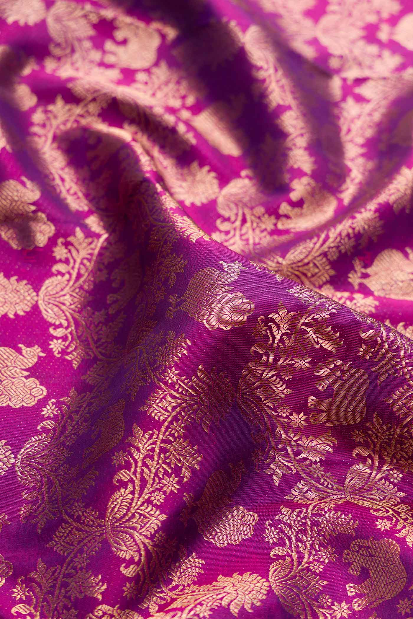 Close up of Purple Dual Tone Kanjivaram Silk Saree with Zari Brocade on the body and Zari Border.  displaying folds