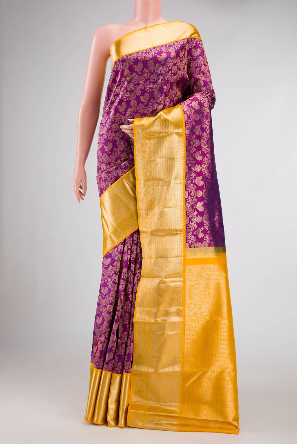 Purple Dual Tone Kanjivaram Silk Saree with Zari Brocade on the body and Zari Border.  displayed on a mannequin