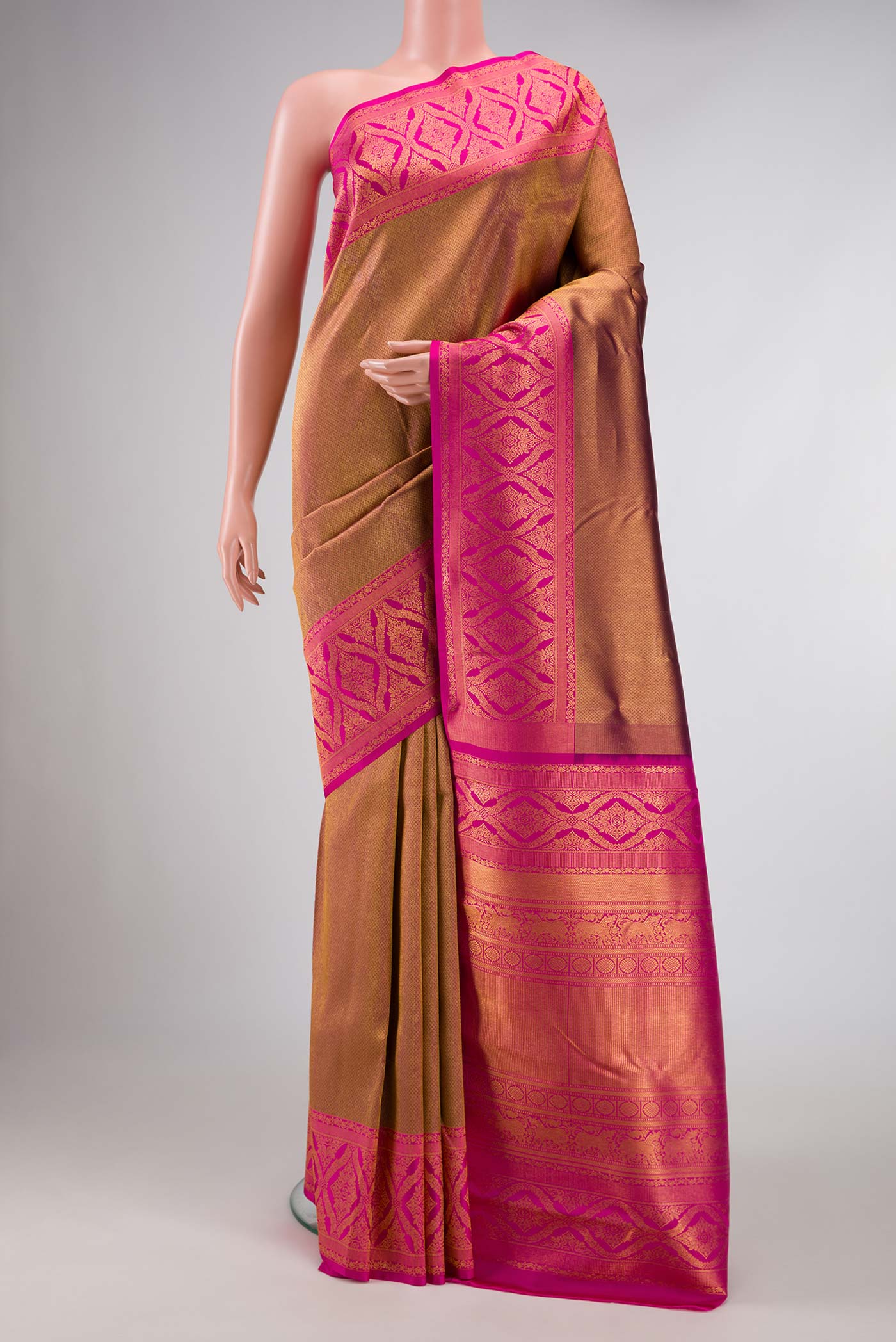 Gold Dual Tone Kanchipuram Silk Saree with Zari Brocade on the body and Zari Border displayed on a mannequin