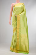 Pista Green Dual Tone Kanjivaram Silk Saree with Zari Brocade on the body and Zari Border.  displayed on a mannequin