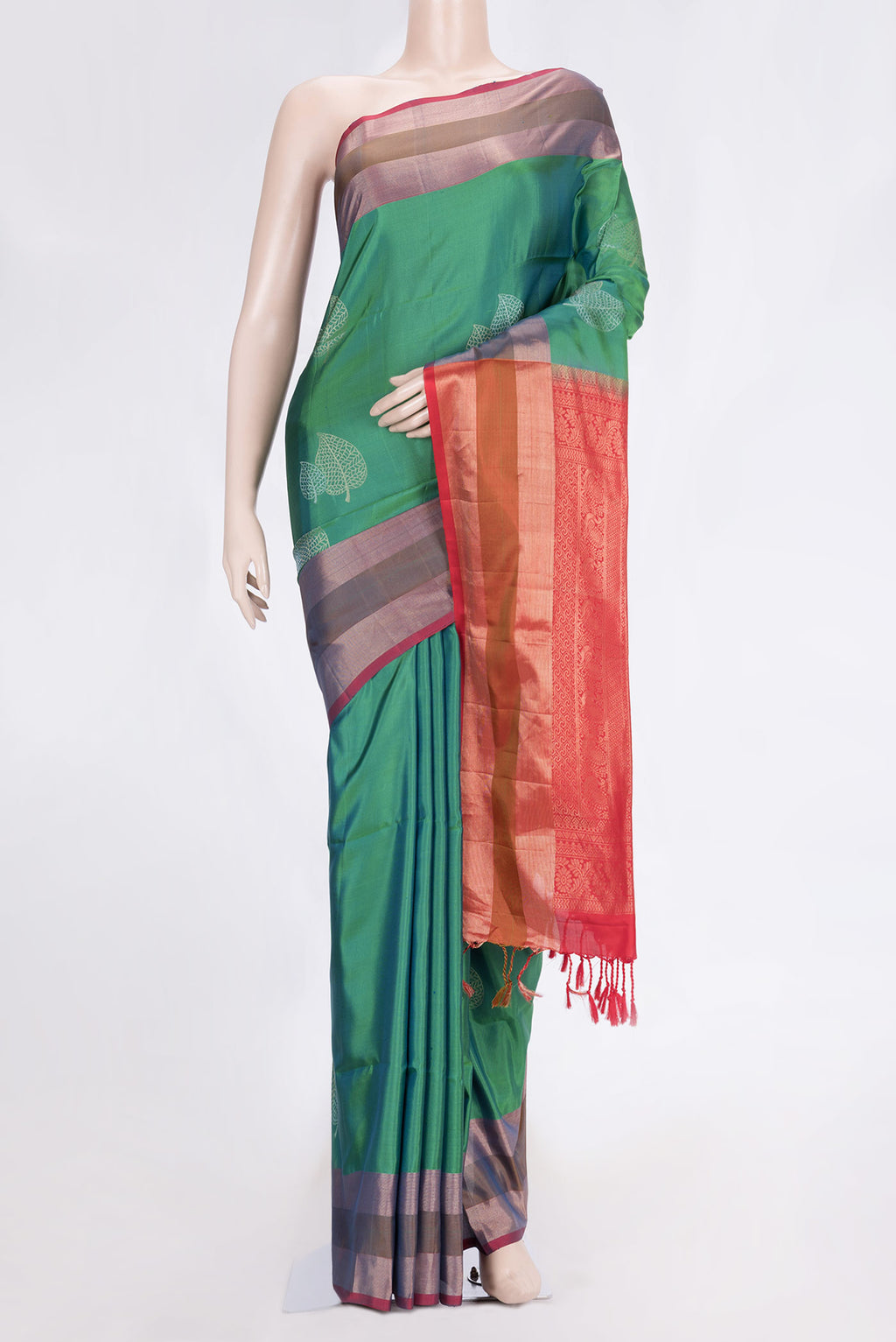 Green Dual Tone Soft Silk Saree with Zari Butta on the body and Zari Border.  displayed on a mannequin