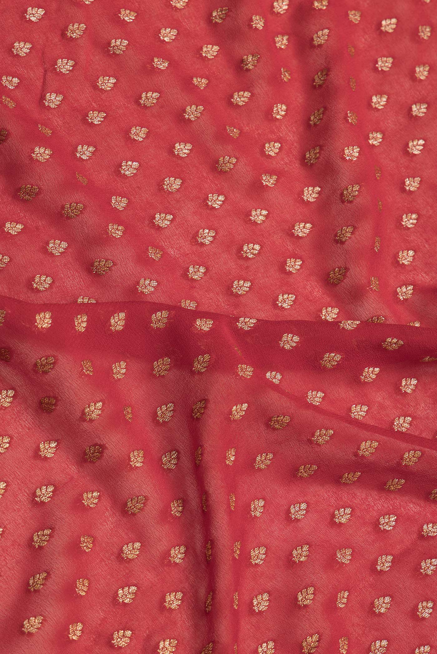 Close up of Red Dual Tone Banarasi Georgette Saree with Zari Butta on the body and Ganga Jamuna Border.  displaying folds