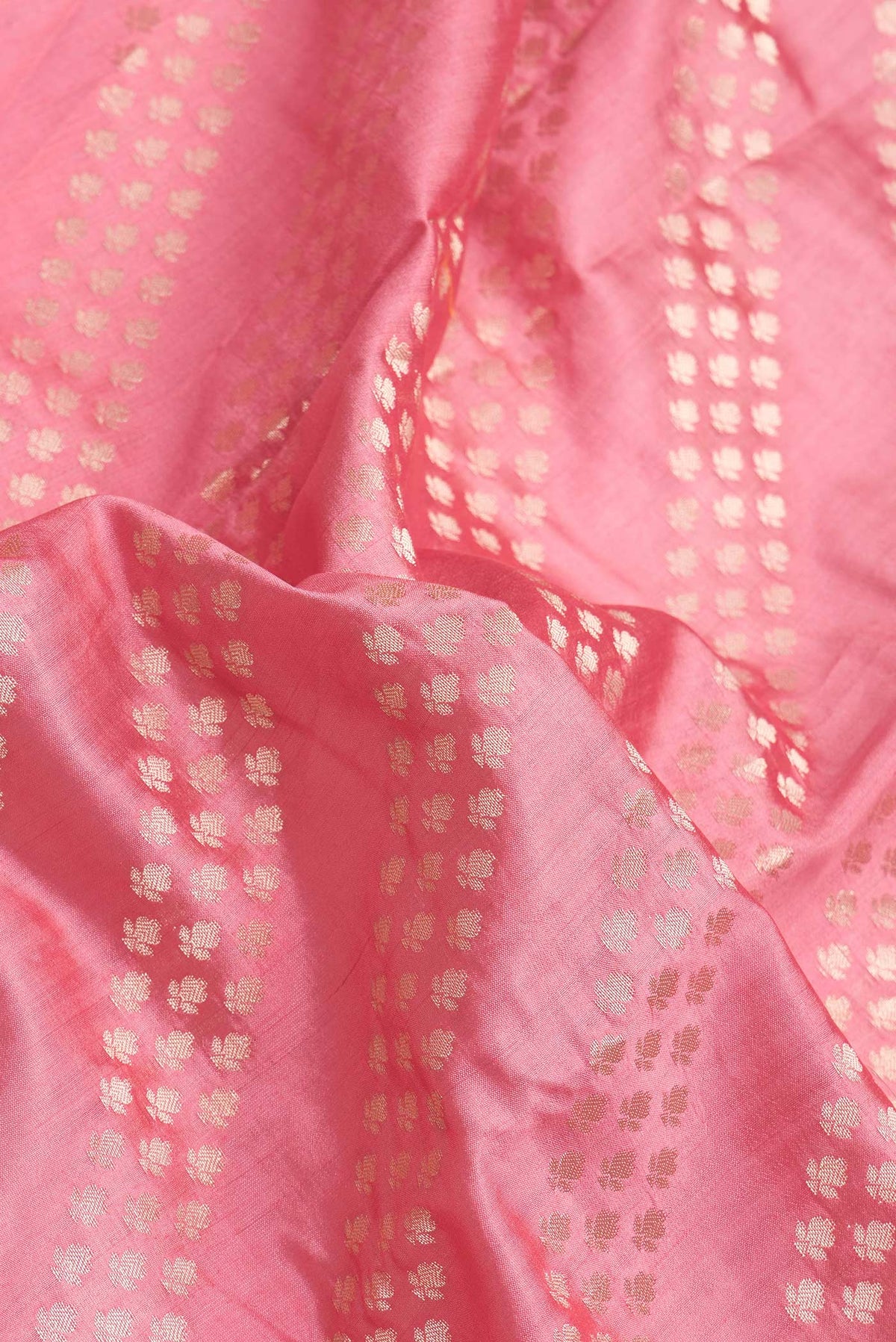Close up of Pink Dual Tone Tussar Silk Saree with Zari Brocade on the body and Zari Border.  displaying folds