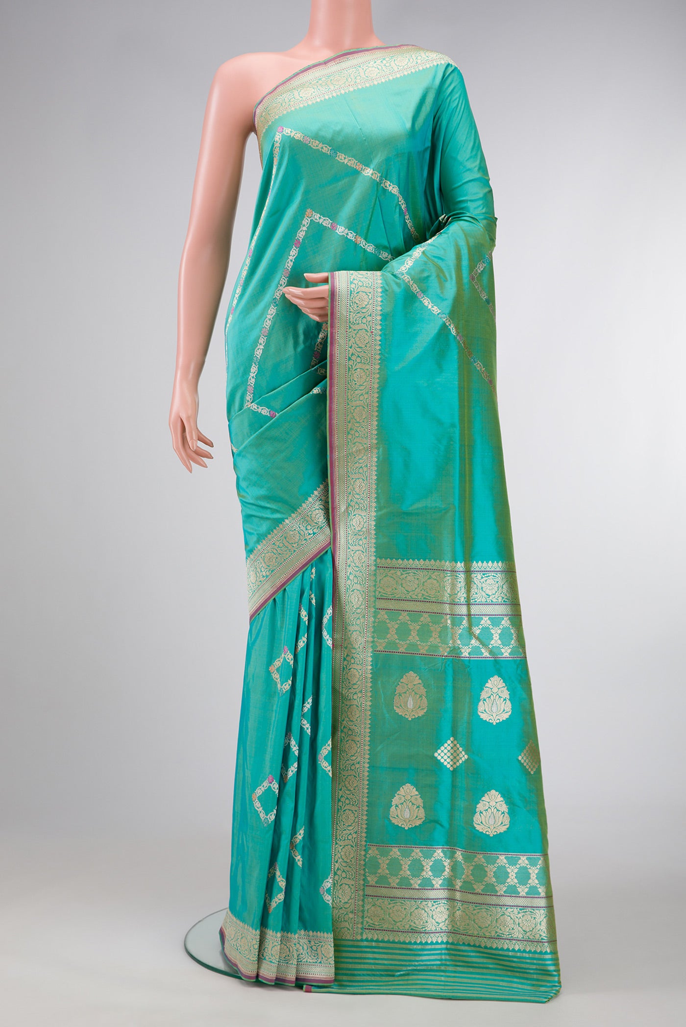 Sea Green Dual Tone Banarasi Silk Saree with Stripes on the body and Zari Border.  displayed on a mannequin