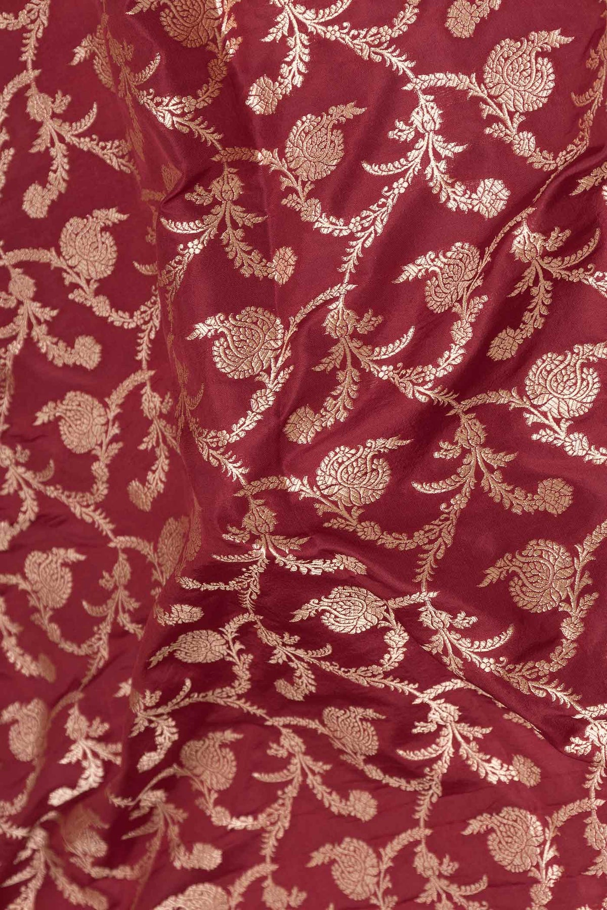Close up of Dark Pink Dual Tone Banarasi Silk Saree with Zari Brocade on the body and Zari Border displaying folds