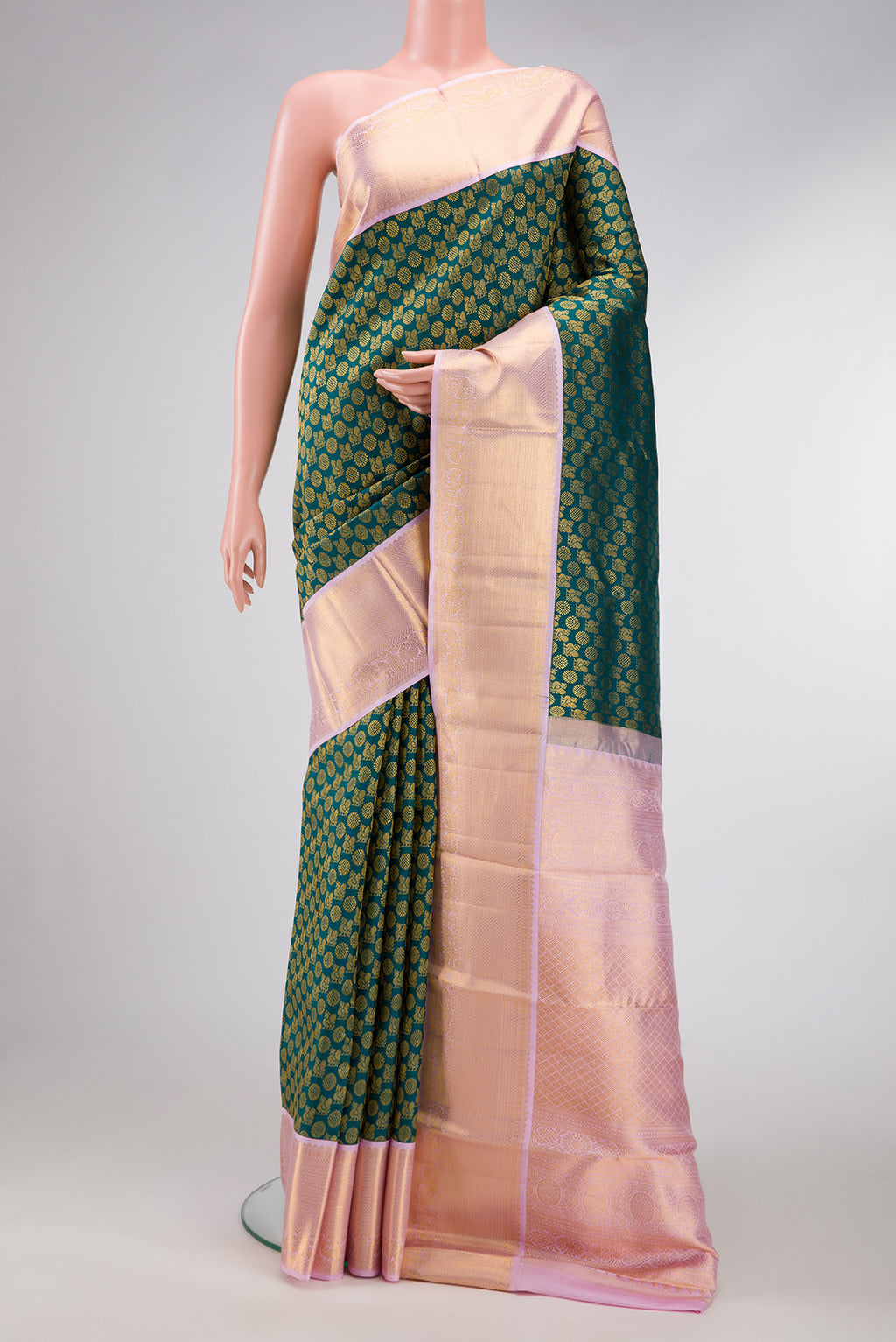 Bottle Green Dual Tone Kanchipuram Silk Saree with Zari Brocade on the body and Zari Border.  displayed on a mannequin
