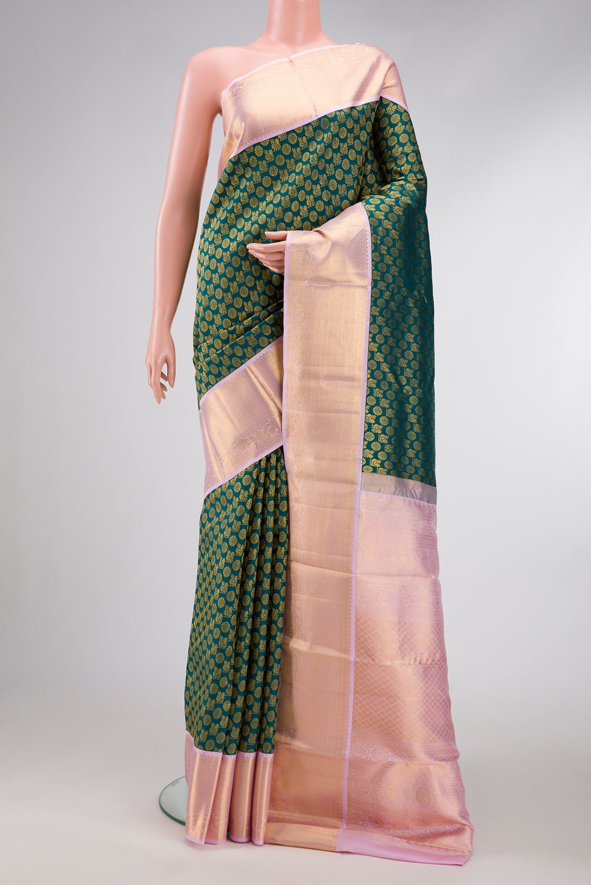 Bottle Green Dual Tone Kanchipuram Silk Saree with Zari Brocade on the body and Zari Border.  displayed on a mannequin