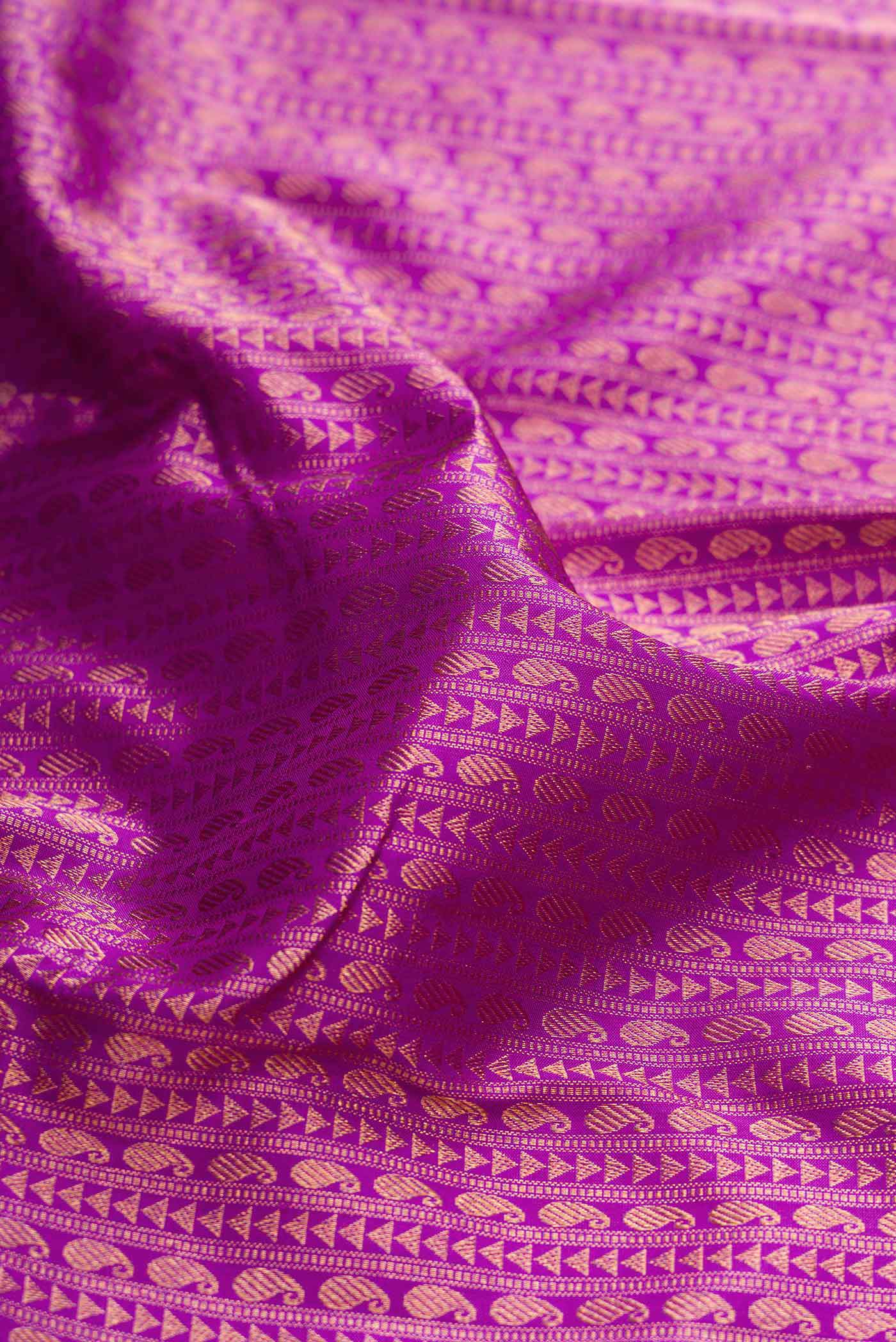 Close up of Purple Dual Tone Kanchipuram Silk Saree with Zari Brocade on the body and Zari Border displaying folds