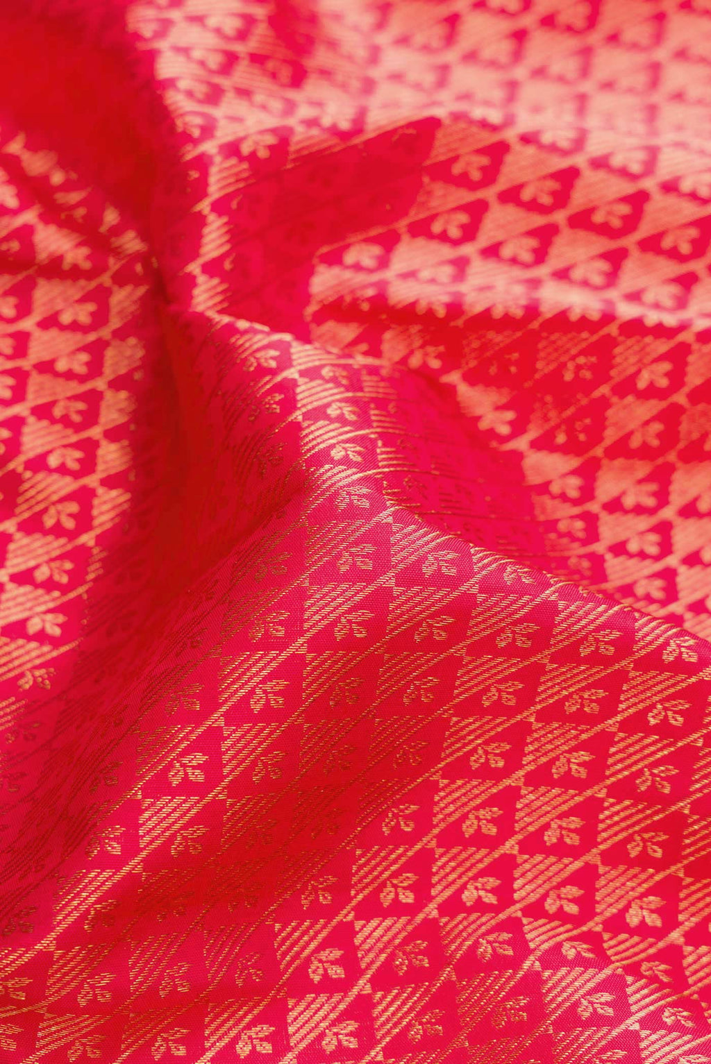 Close up of Pink Dual Tone Kanjivaram Silk Saree with Zari Brocade on the body and Zari Border.  displaying folds