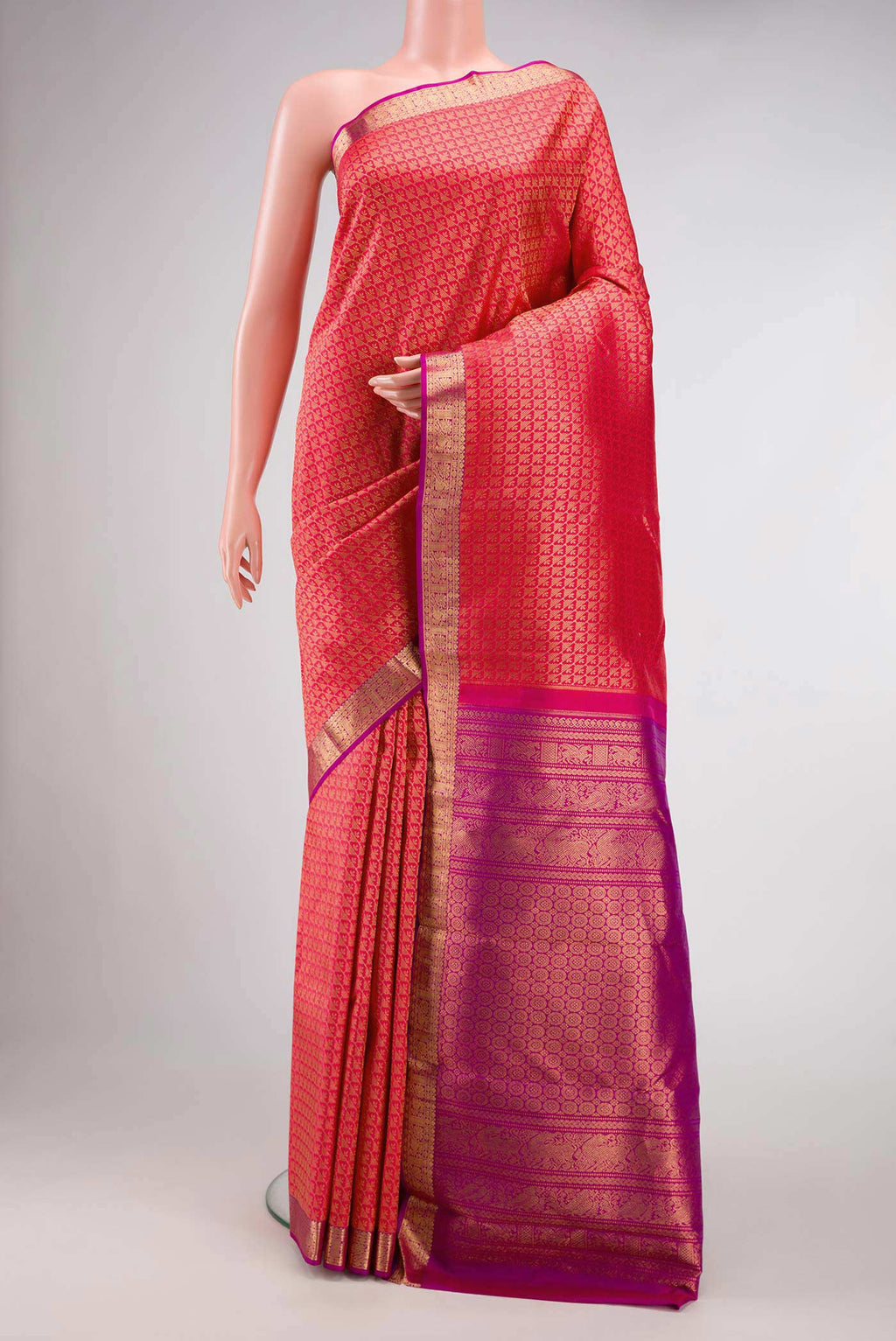 Pink Dual Tone Kanjivaram Silk Saree with Zari Brocade on the body and Zari Border.  displayed on a mannequin