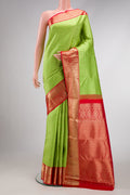 Parrot Green Dual Tone Kanchipuram Silk Saree with Zari Brocade on the body and Zari Border.  displayed on a mannequin