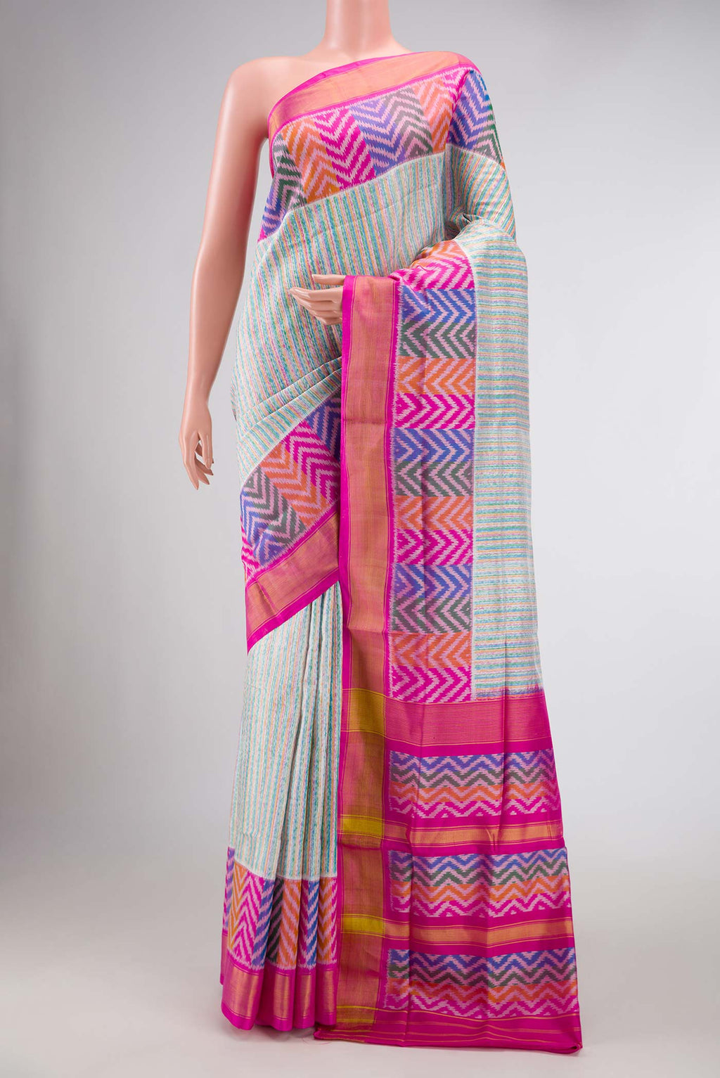 Grey Dual Tone Rajkot Patola Silk Saree with Ikat Print on the body and Ikat Border displayed on a mannequin