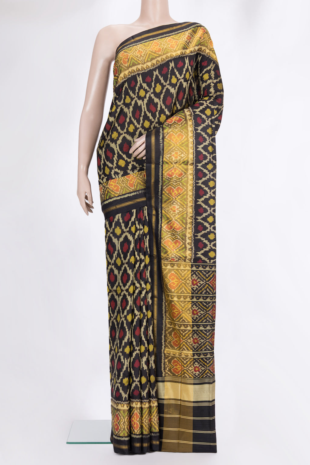 Pure Silk Black Rajkot Patola Saree with Pure Ikat on the body and Ikat Border.  displayed on a mannequin