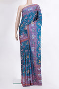 Pure Silk Peacock Blue Rajkot Patola Saree with Pure Ikat on the body and Ikat Border.  displayed on a mannequin