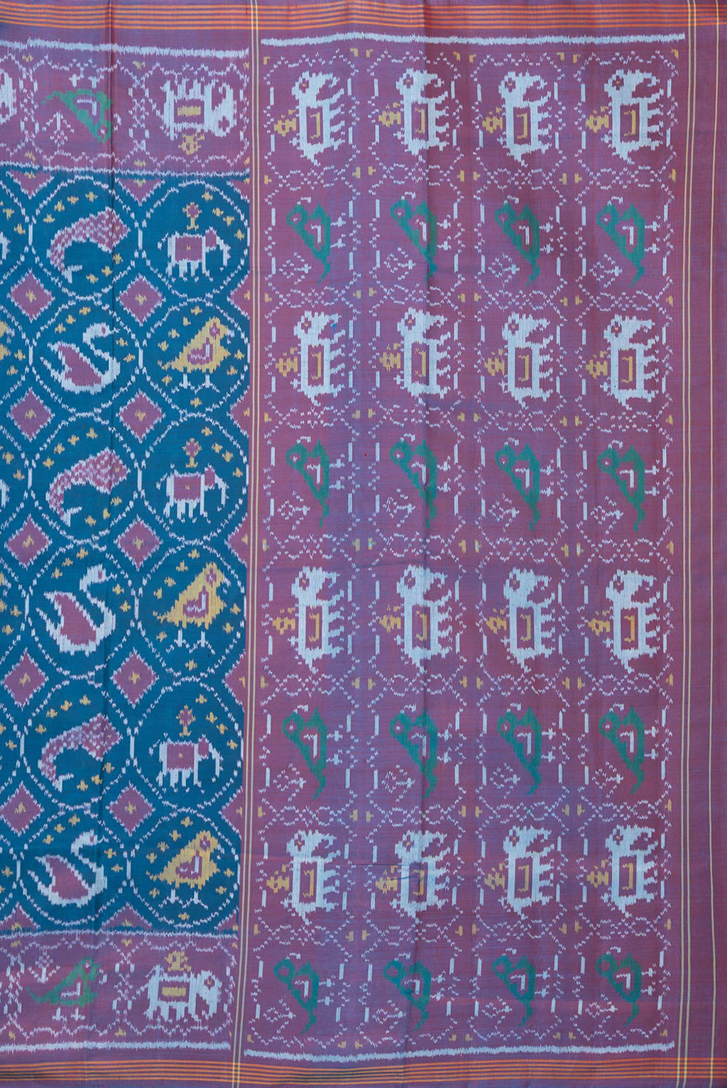 Close up image of the pallu of Pure Silk Peacock Blue Rajkot Patola Saree with Pure Ikat on the body and Ikat Border. 