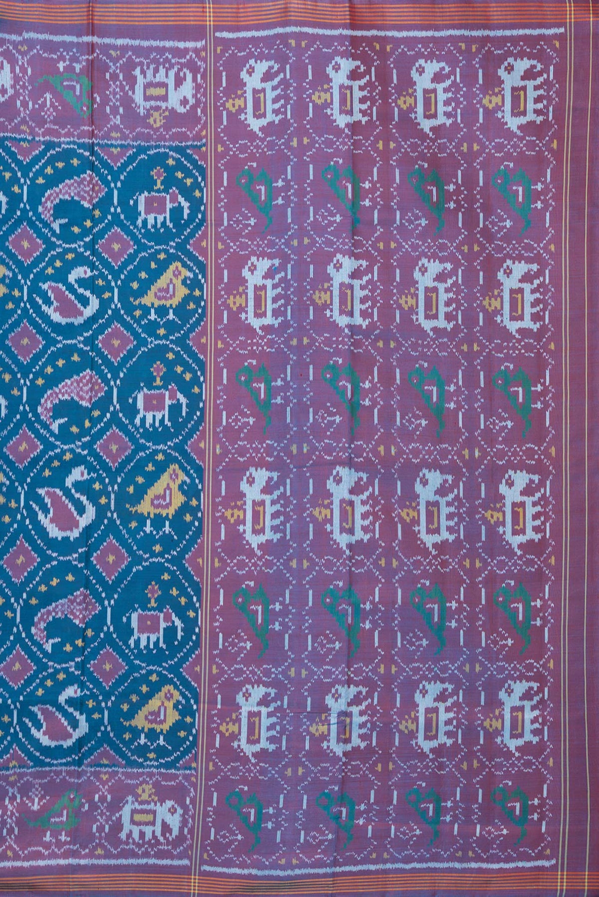 Close up image of the pallu of Pure Silk Peacock Blue Rajkot Patola Saree with Pure Ikat on the body and Ikat Border. 