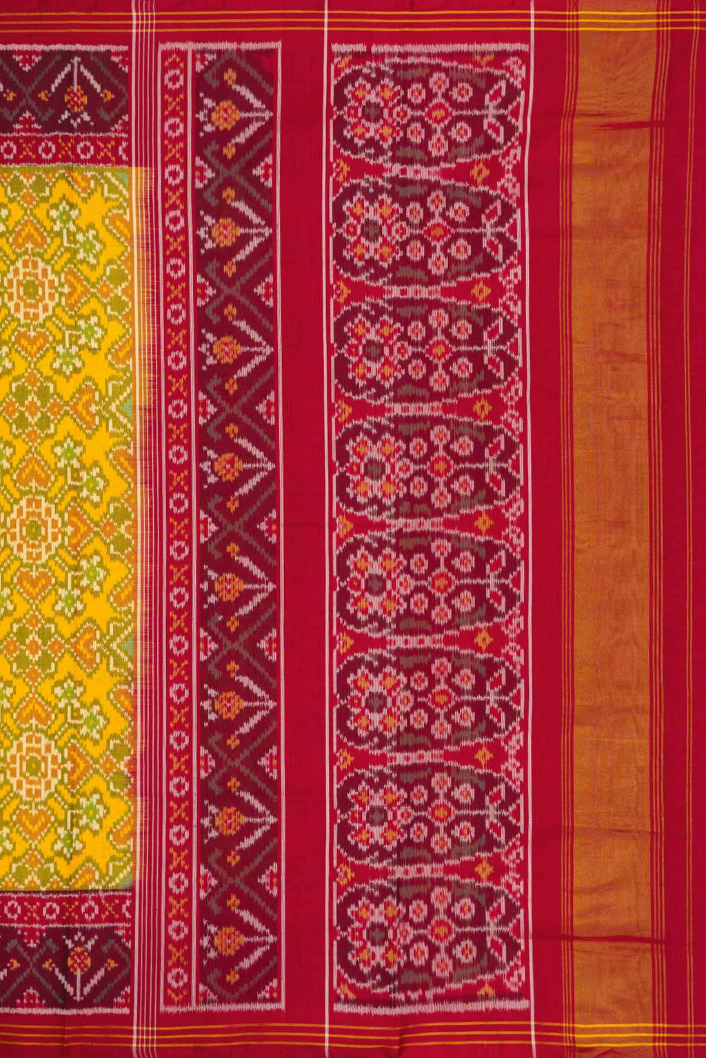 Close up image of the pallu of Yellow Dual Tone Rajkot Patola Silk Saree with Ikat Print on the body and Ikat Border
