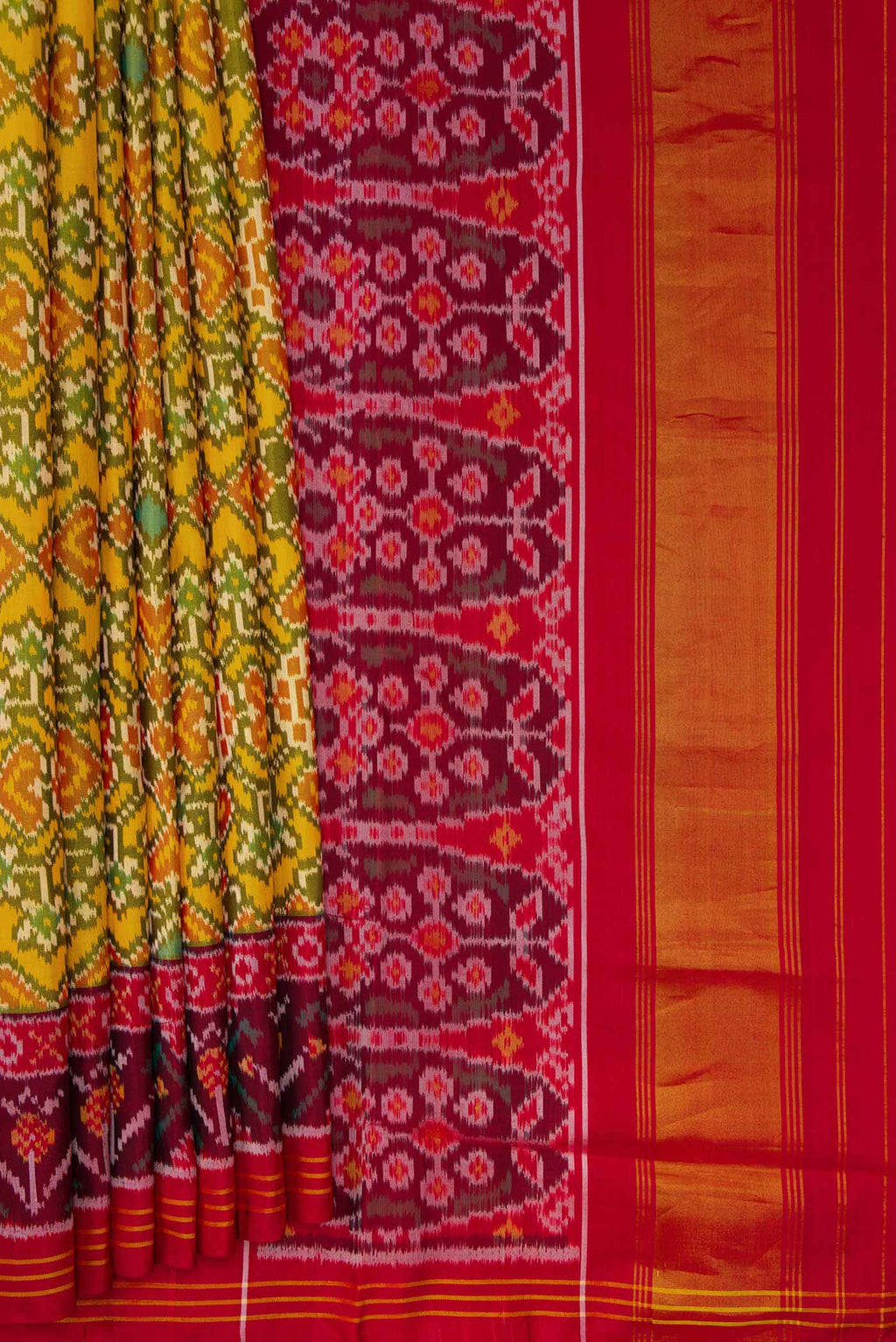 Pleats and pallu of Yellow Dual Tone Rajkot Patola Silk Saree with Ikat Print on the body and Ikat Border