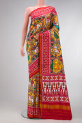 Mustard Dual Tone Double Ikat Saree with Ikat Print on the body and Ikat Border.  displayed on a mannequin
