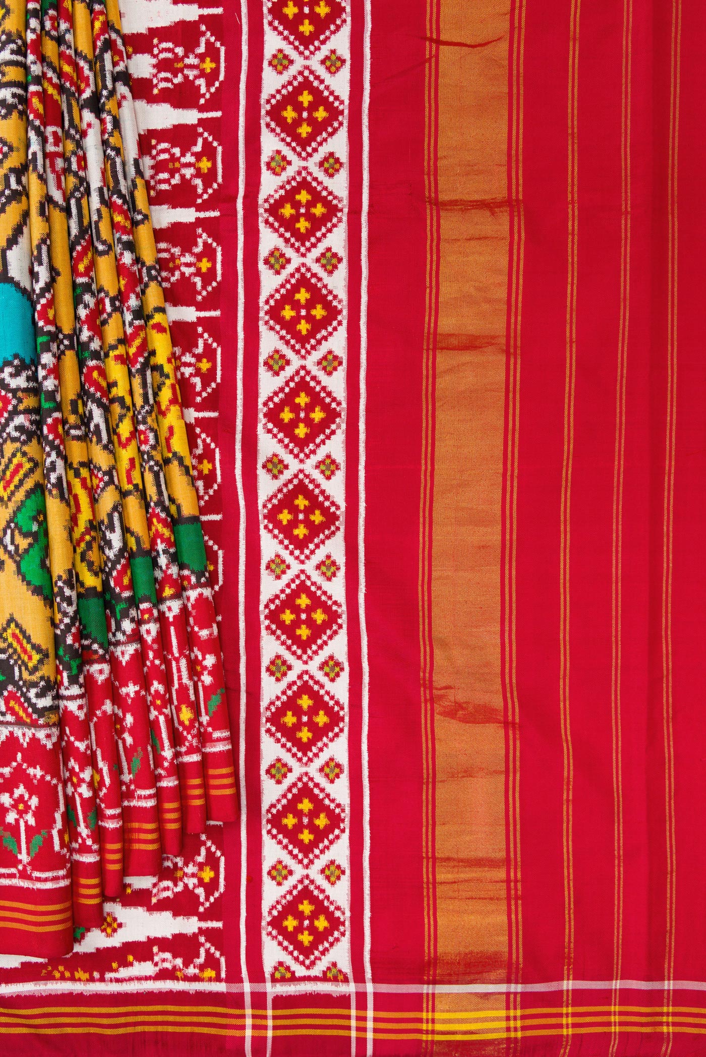 Pleats and pallu of Mustard Dual Tone Double Ikat Saree with Ikat Print on the body and Ikat Border. 