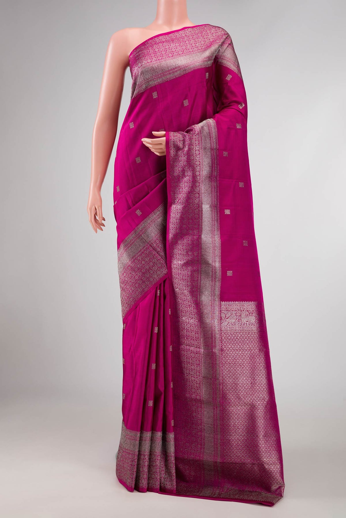 Magenta Dual Tone Kanchipuram Silk Saree with Zari Butta on the body and Zari Border displayed on a mannequin