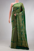 Bottle Green Kanchipuram Silk Saree with Zari Brocade on the body and Fancy Border.  displayed on a mannequin