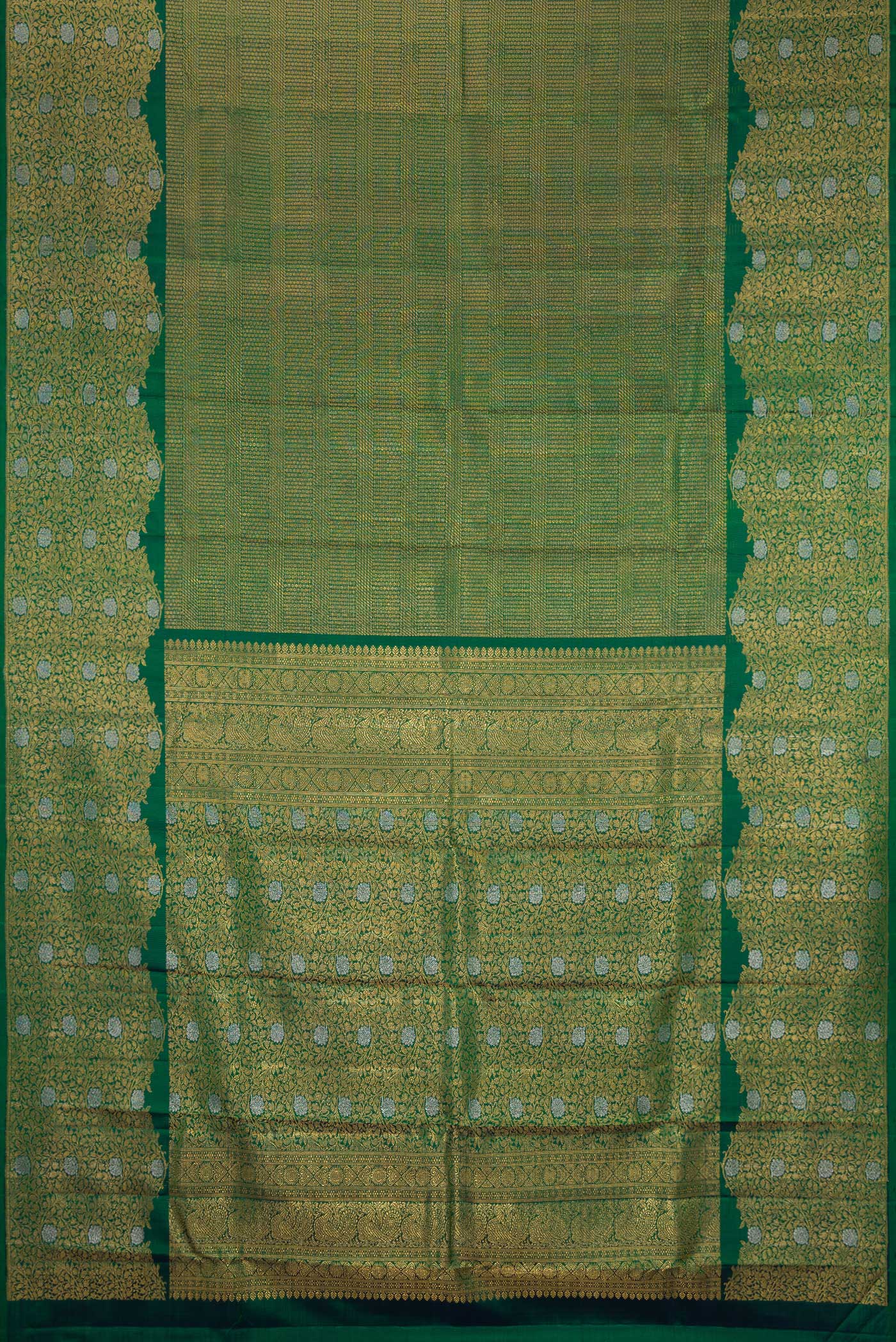 Flat view of Bottle Green Kanchipuram Silk Saree with Zari Brocade on the body and Fancy Border. 