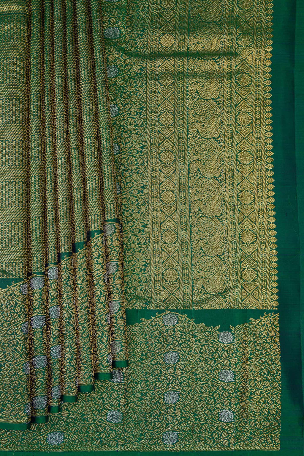 Pleats and pallu of Bottle Green Kanchipuram Silk Saree with Zari Brocade on the body and Fancy Border. 