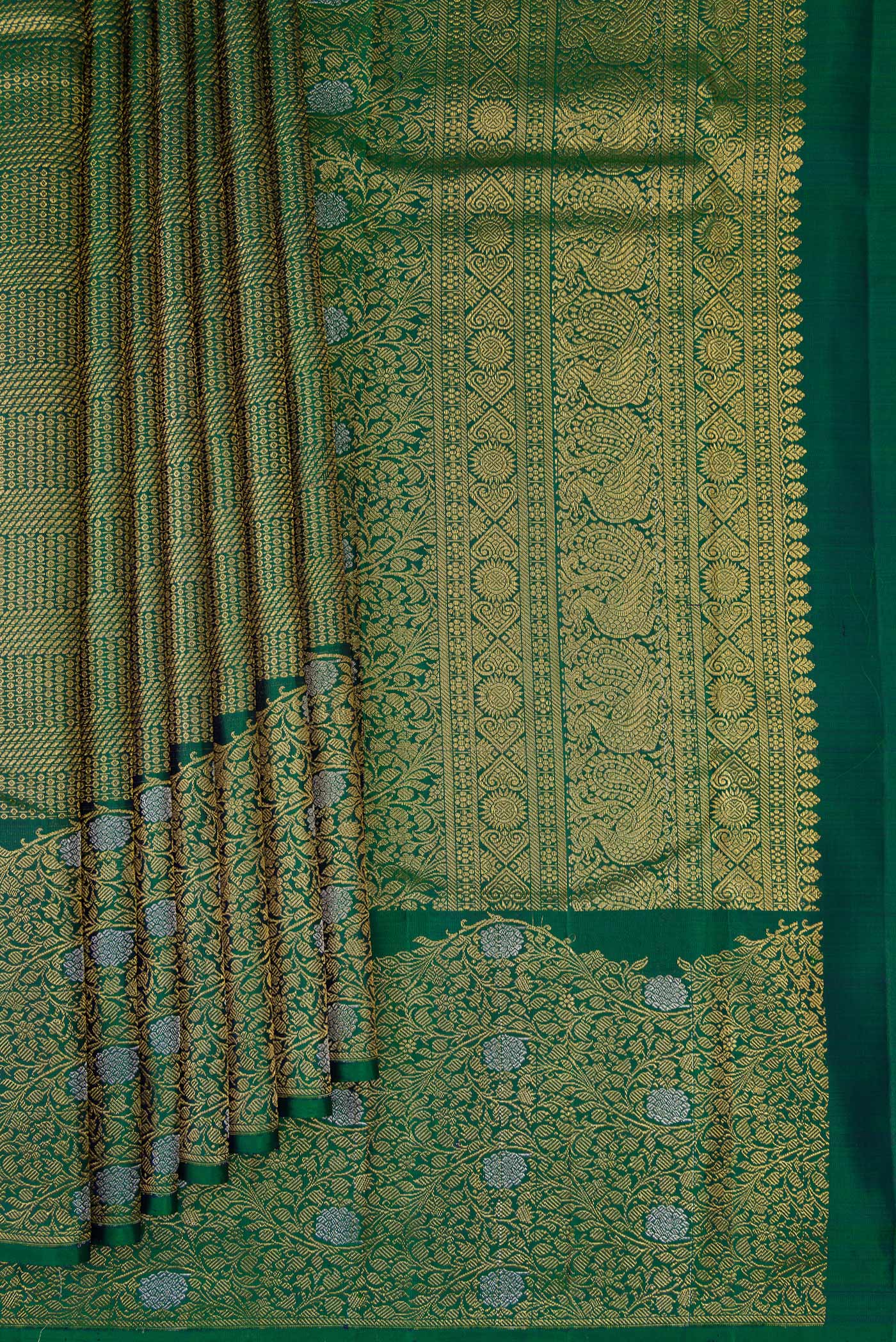 Pleats and pallu of Bottle Green Kanchipuram Silk Saree with Zari Brocade on the body and Fancy Border. 