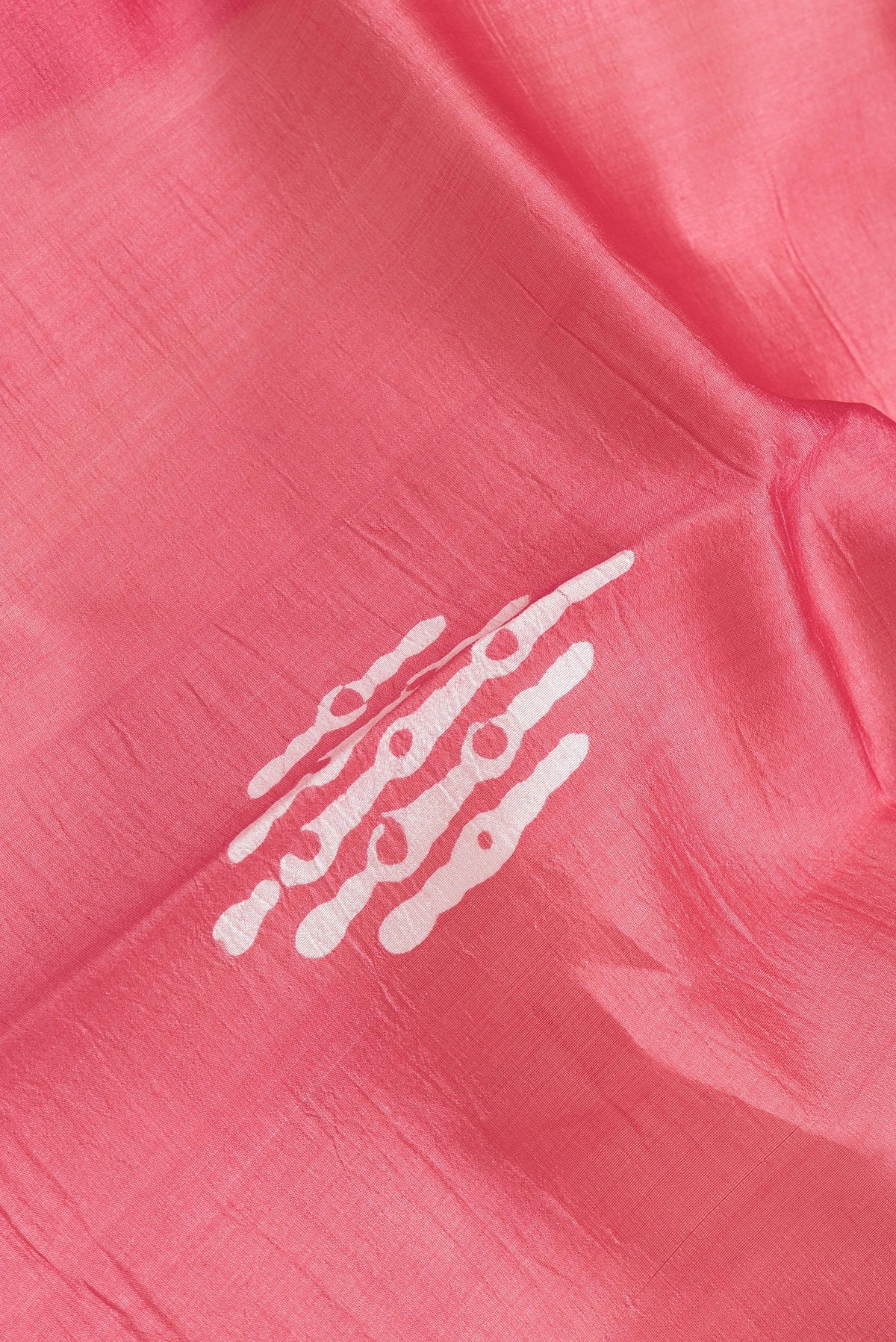 Close up of Pink Dual Tone Tussar Silk Saree with Printed design on the body and Printed Border.  displaying folds