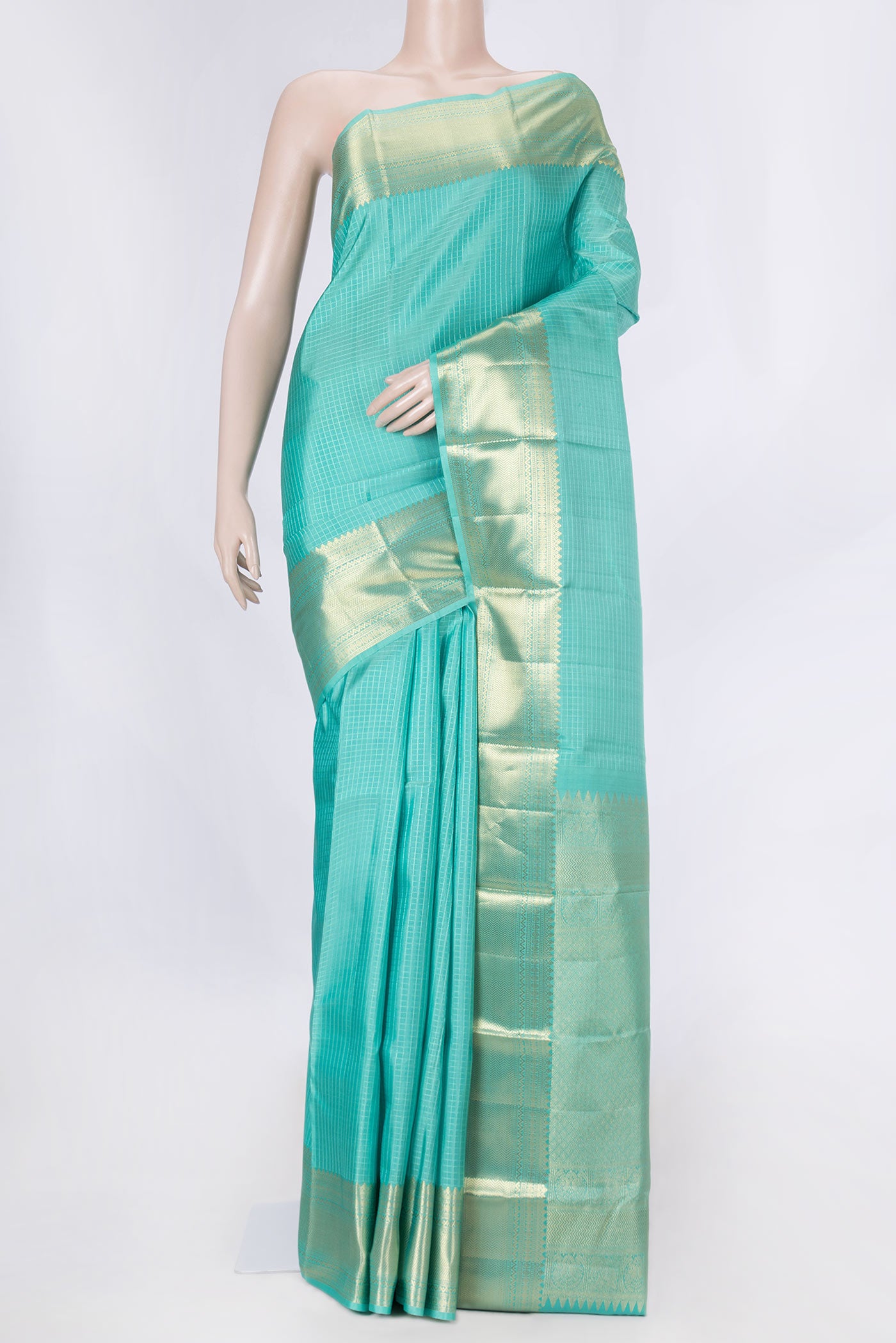 Sea Green Dual Tone Kanchipuram Saree with Checked design on the body and Zari Border displayed on a mannequin
