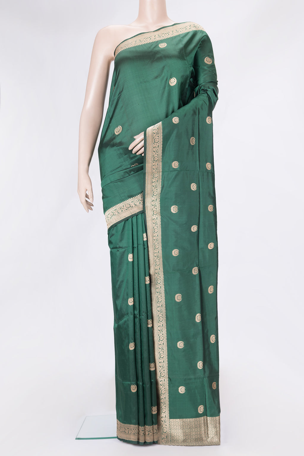 Bottle Green Dual Tone Banarasi Silk Saree with Zari Butta on the body and Zari Border.  displayed on a mannequin